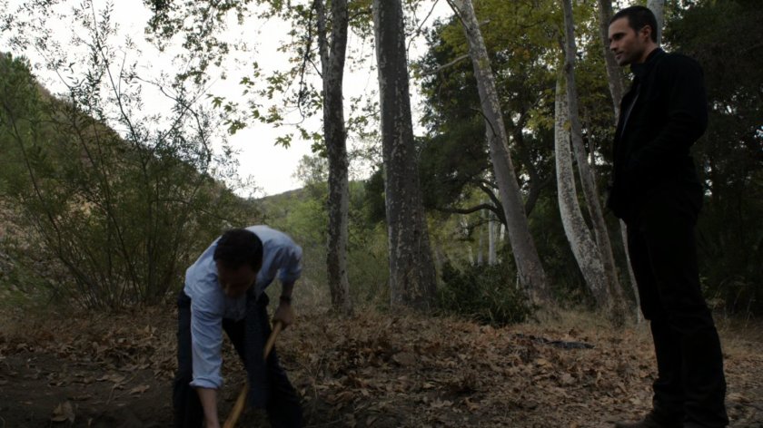 Christian Ward digs a hole in the Massachusetts woods, while Grant Ward watches.