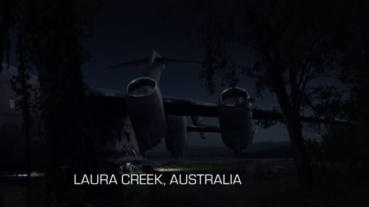 The Bus parked at night in a field. Text: Laura Creek, Australia.
