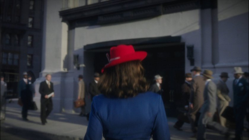 Peggy walking towards New York Bell building.