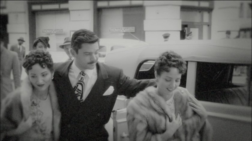 Howard Stark and two women across from Law Offices.