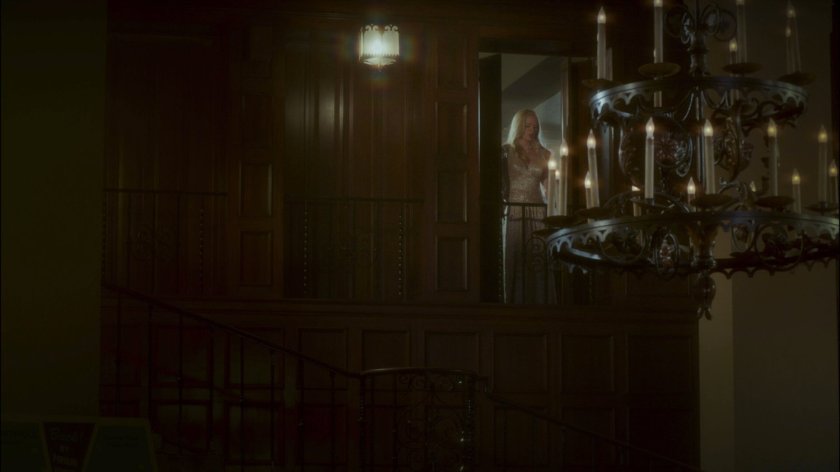 Outside of Spider Raymond's office as Peggy closes shutters.