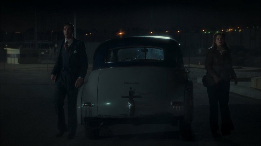 Peggy and Jarvis watch Roxxon refinery implode.