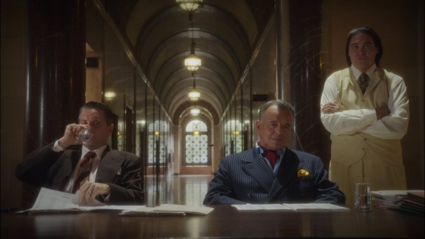 Dooley and Hugh Jones in the Roxxon lobby.