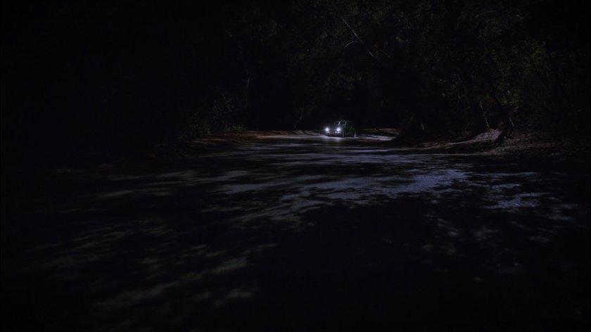 Car on a dark, twisty New Jersey road.