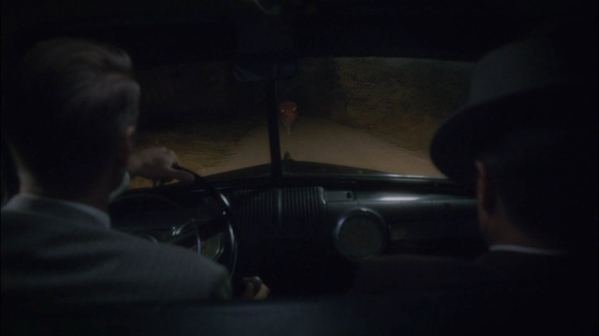 Thompson and Dooley pull Sheldon McFee over on dirt road.