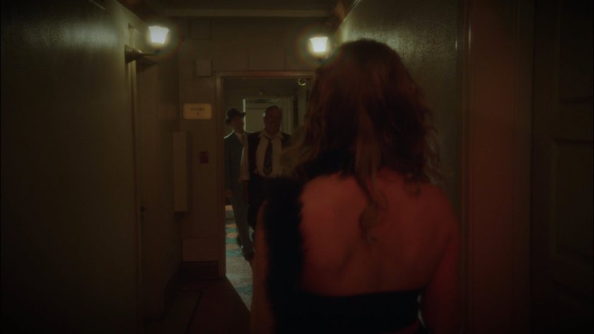 Woman in hallway of Hotel Cosmopole.