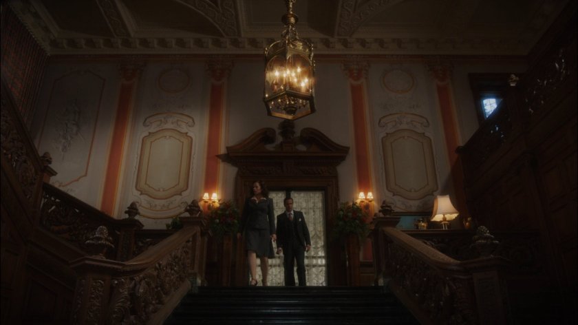 Peggy and Jarvis in the foyer of Howard Stark's mansion.