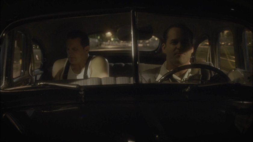 Jerome Zandow and Agent Krzeminski drive on a wet street.