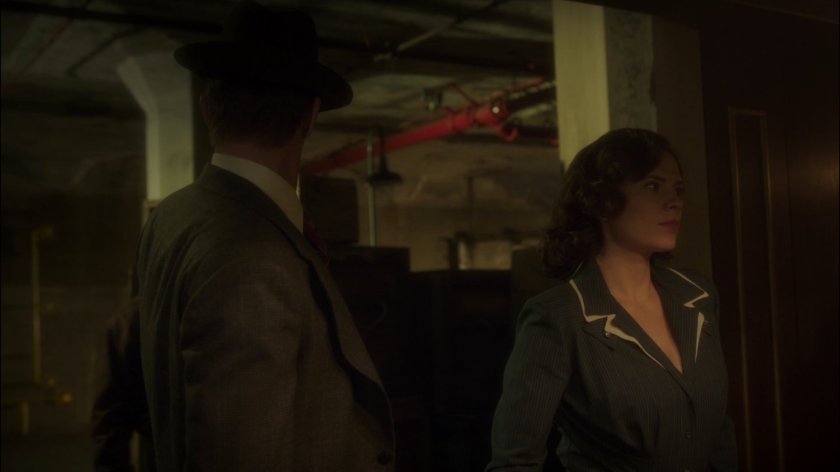 Peggy and Jarvis inside railyards warehouse.