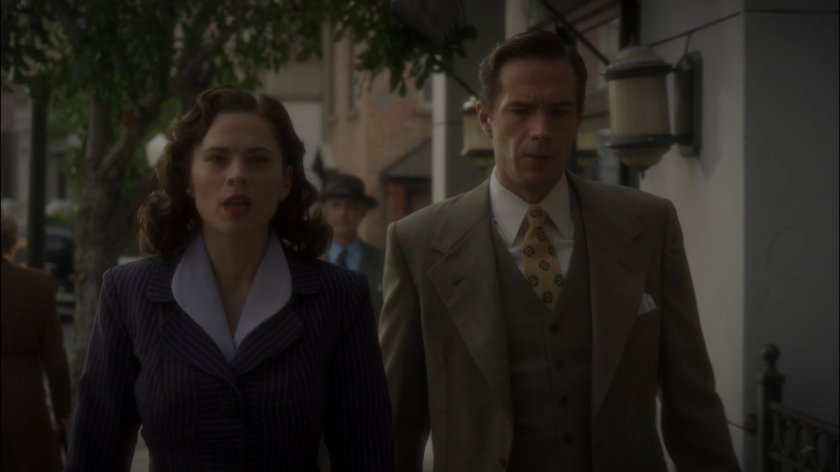 Peggy and Jarvis on a sidewalk in New York city.