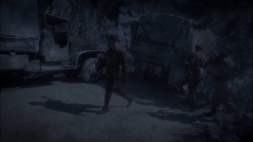 Dum Dum Dugan and two Army trucks in a Polish forest.