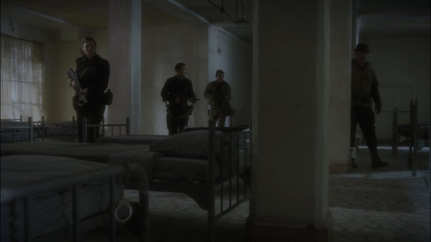 The Howling Commandos in a derelict dormitory.