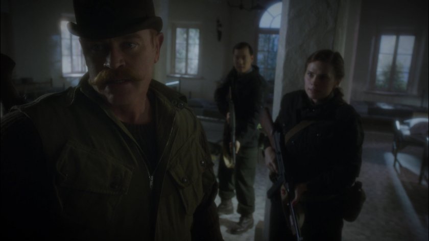Dum Dum Dugan and Peggy in a derelict dormitory.