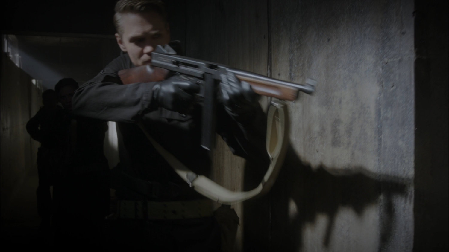 Thompson takes aim down a hallway of Belarus prison.