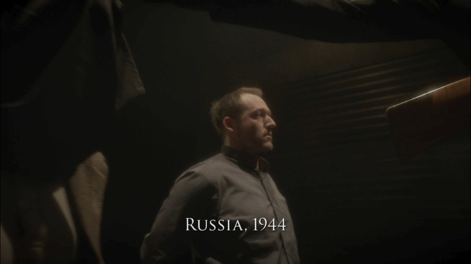 Man in cellar. Text: Russia, 1944.