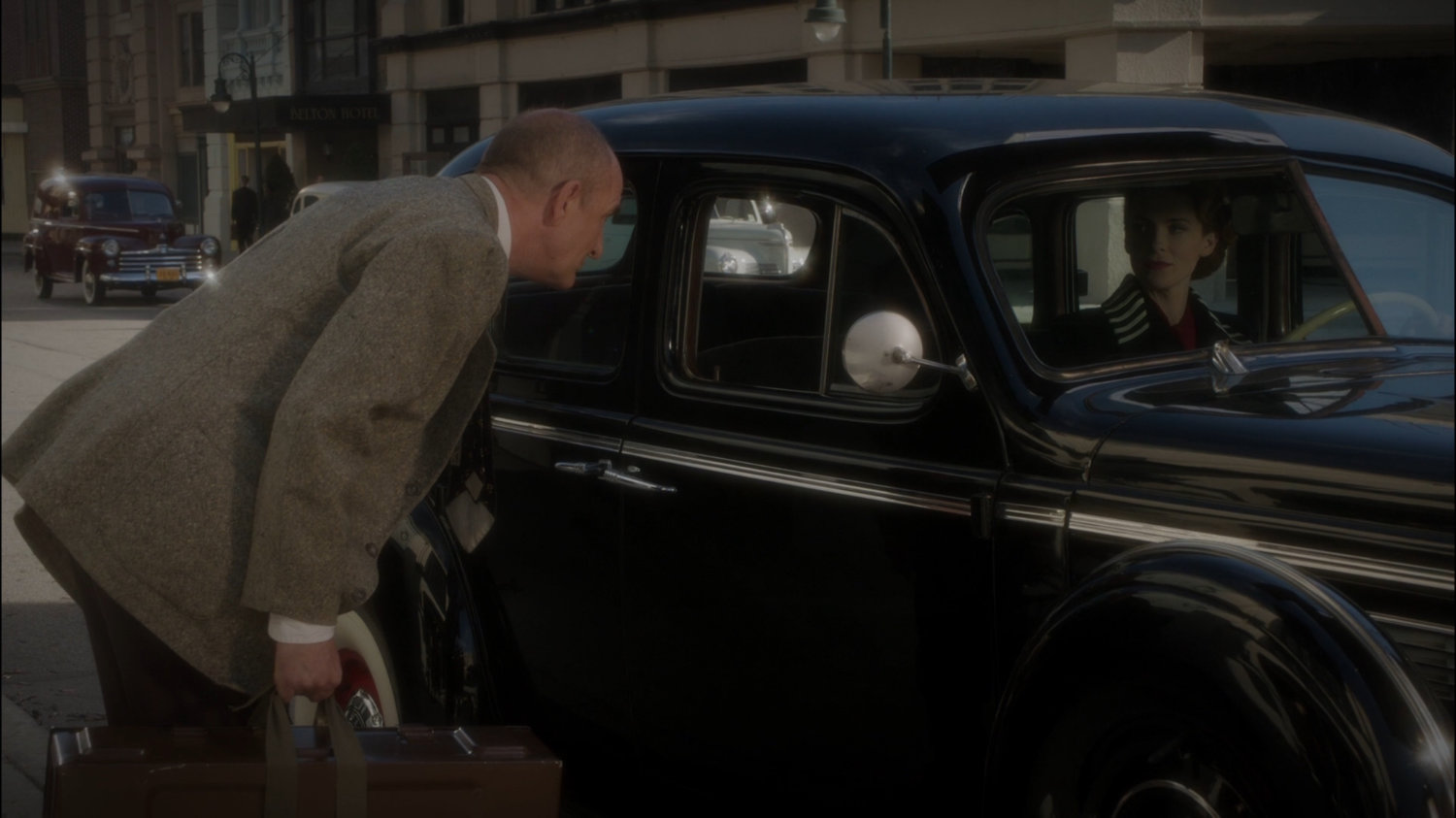 Dr. Ivchenko speaks to Dottie in car outside Hudson Grand Hotel.
