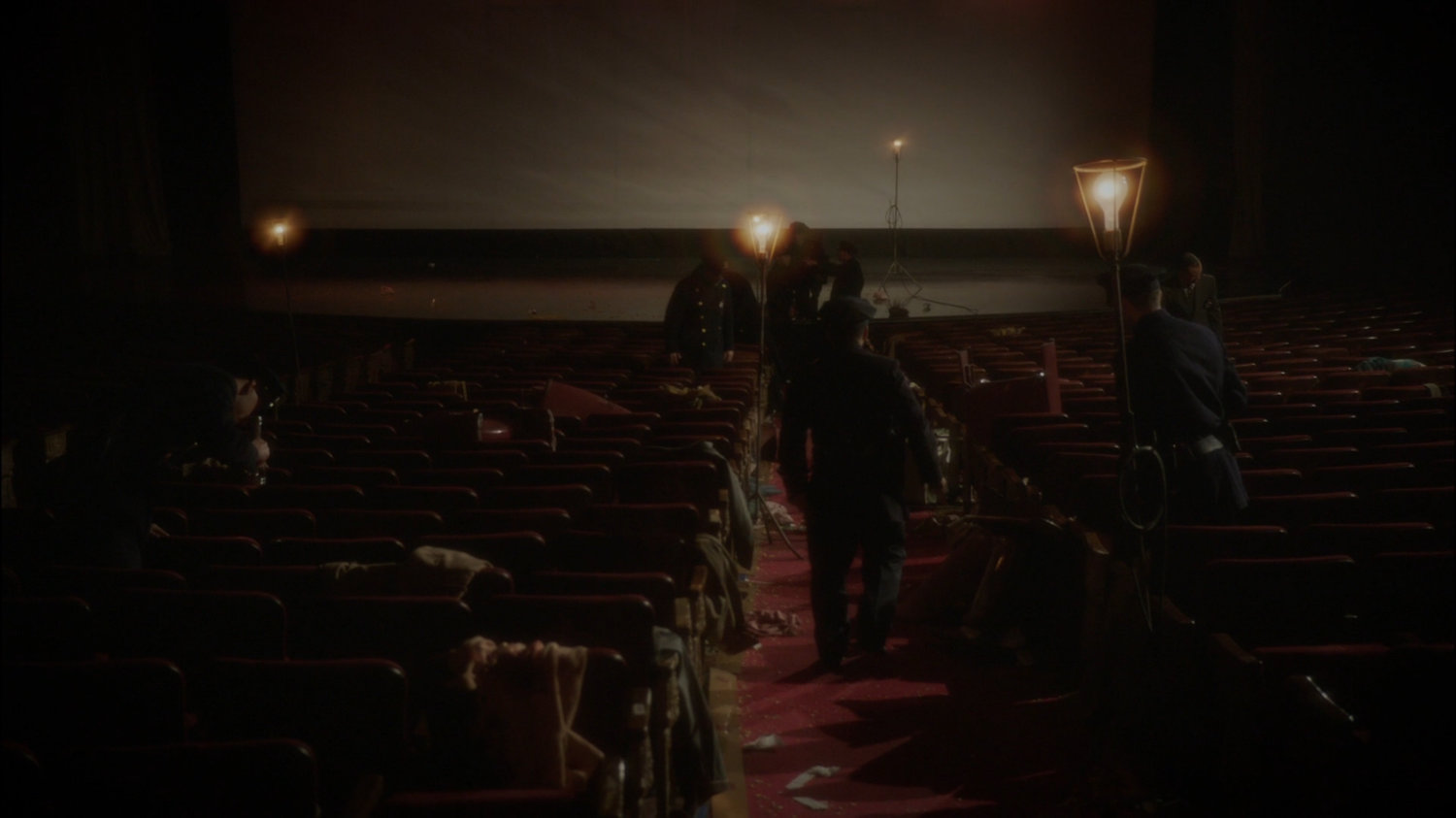 Police investigate deaths in New York movie theater.
