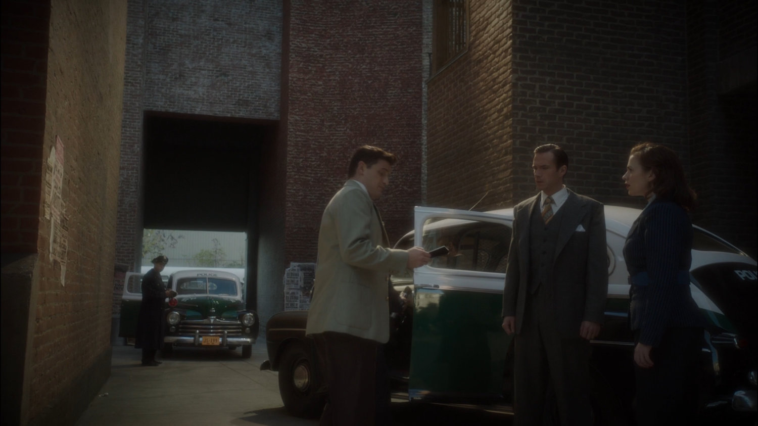 Sousa, Jarvis, and Peggy in a New York alley.