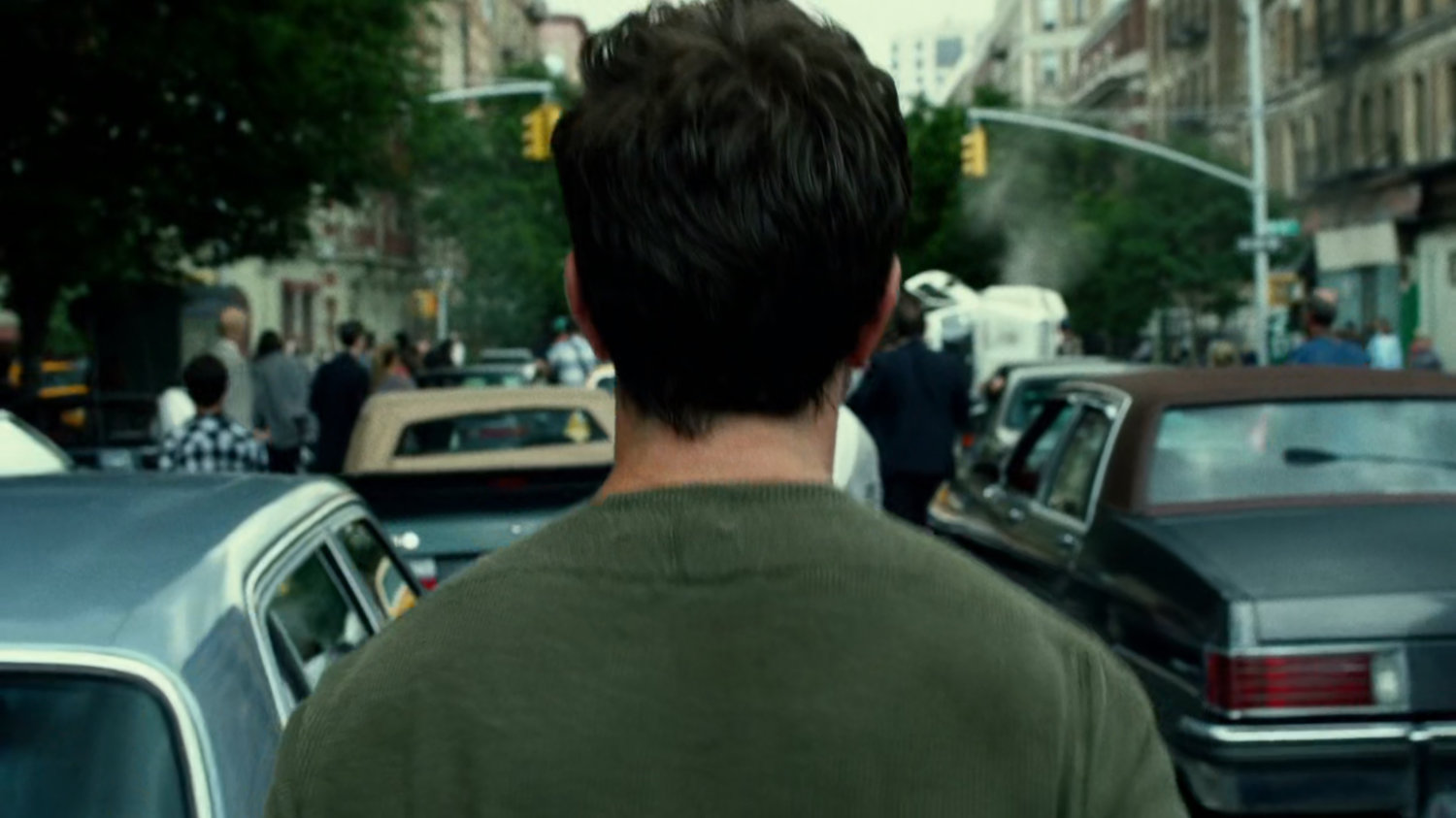 Jack Murdock walking into crowded intersection.