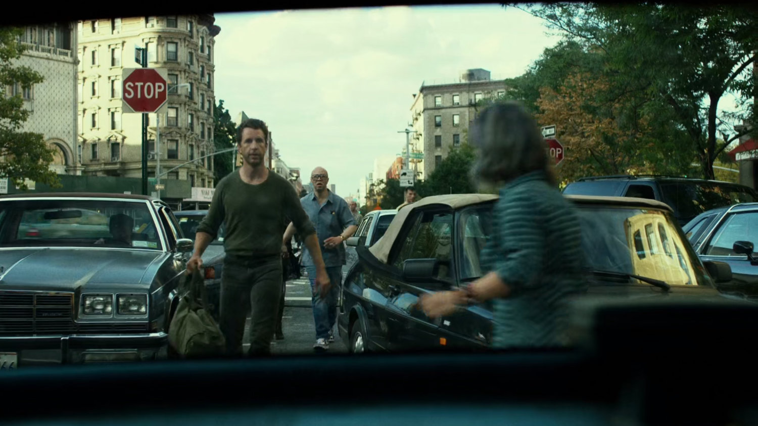 Jack Murdock walking into crowded intersection.