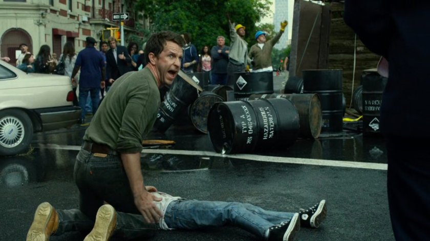 Jack Murdock kneeling over his son Matt in a crowded intersection.
