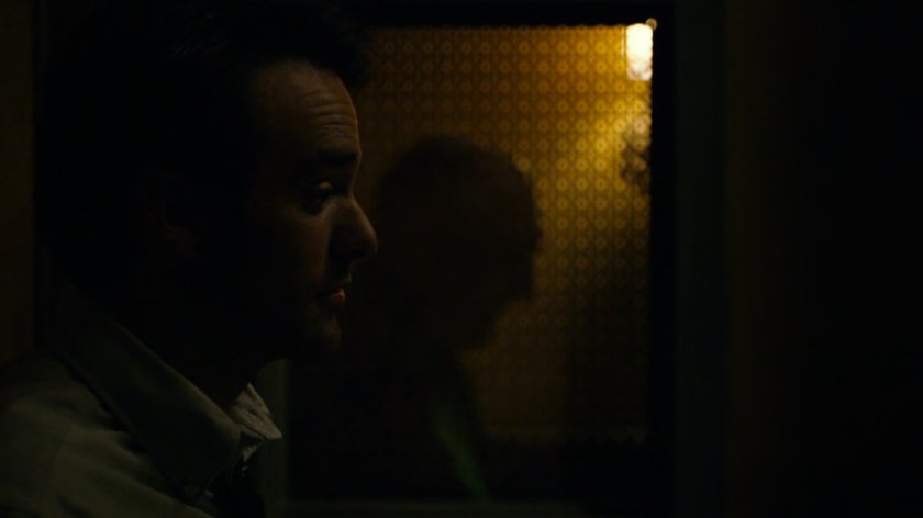 Matt in a church confessional.