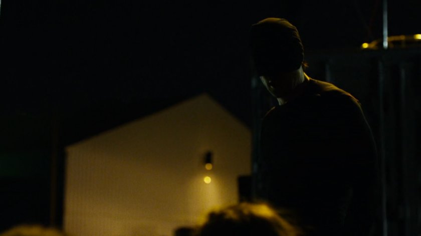 Daredevil at a dark container yard in Brooklyn.