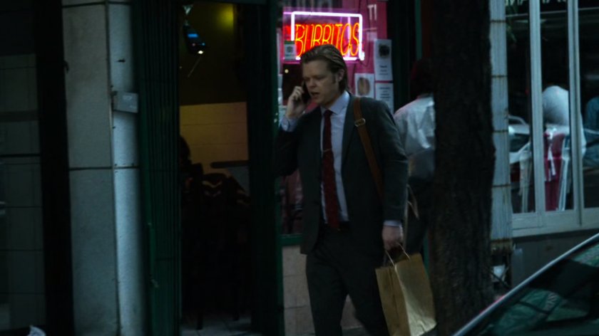 Foggy on the phone on a sidewalk.