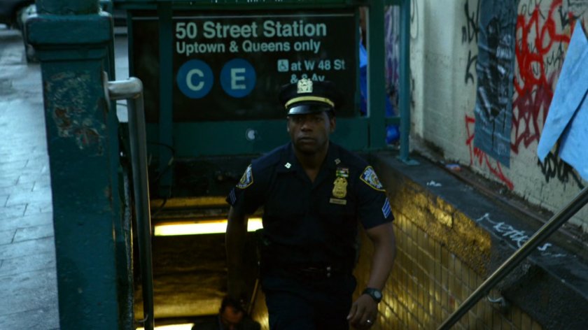 Officer Brett Mahoney emerges from a subway station.