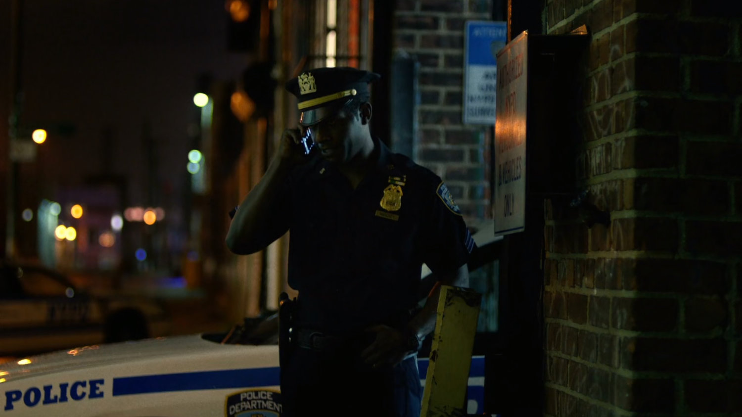 Brett Mahoney making a call outside the 15th Precinct.