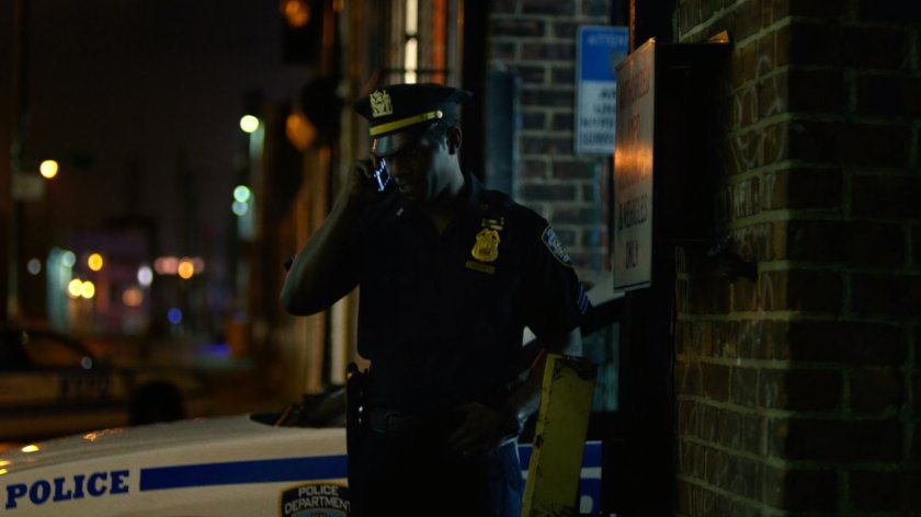 Brett Mahoney making a call outside the 15th Precinct.