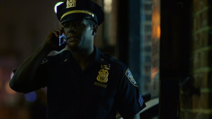 Brett Mahoney making a call outside the 15th Precinct.