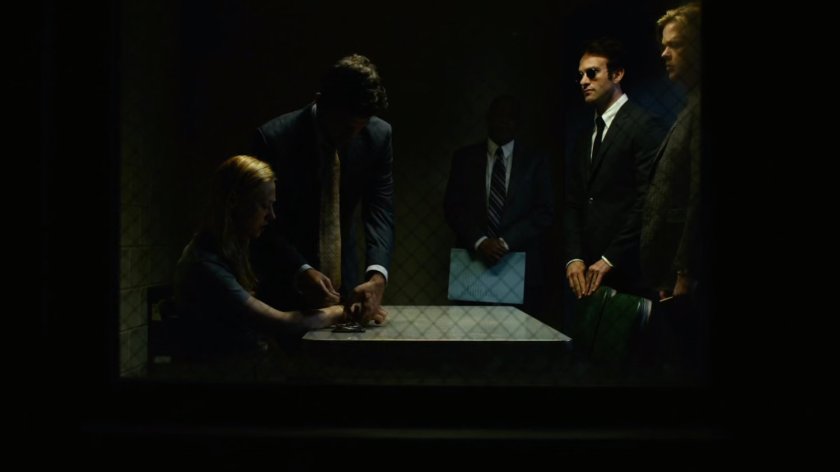 Matt & Foggy stand by Karen and two detectives in an interrogation room.