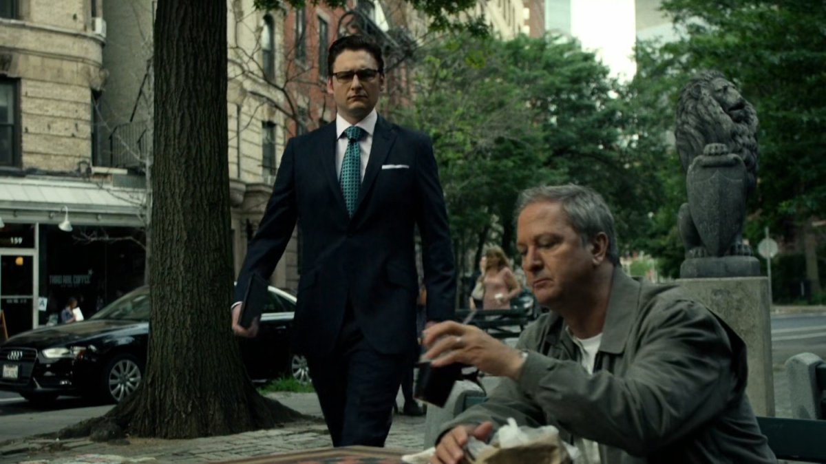 Wesley approaches Farnum in a park.