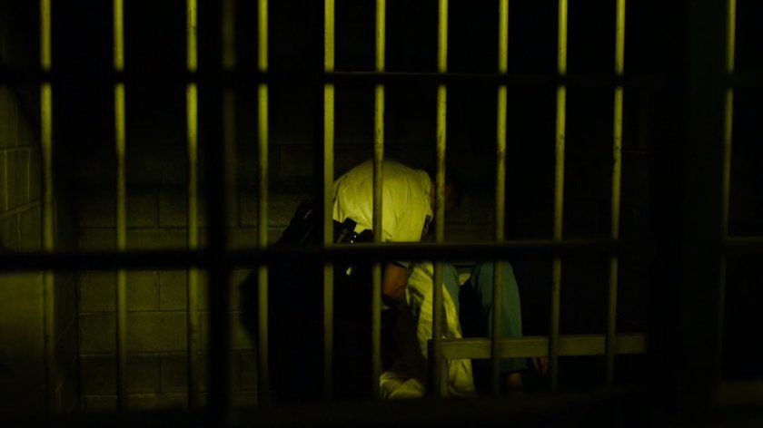 Police officer strangles Karen in jail cell.