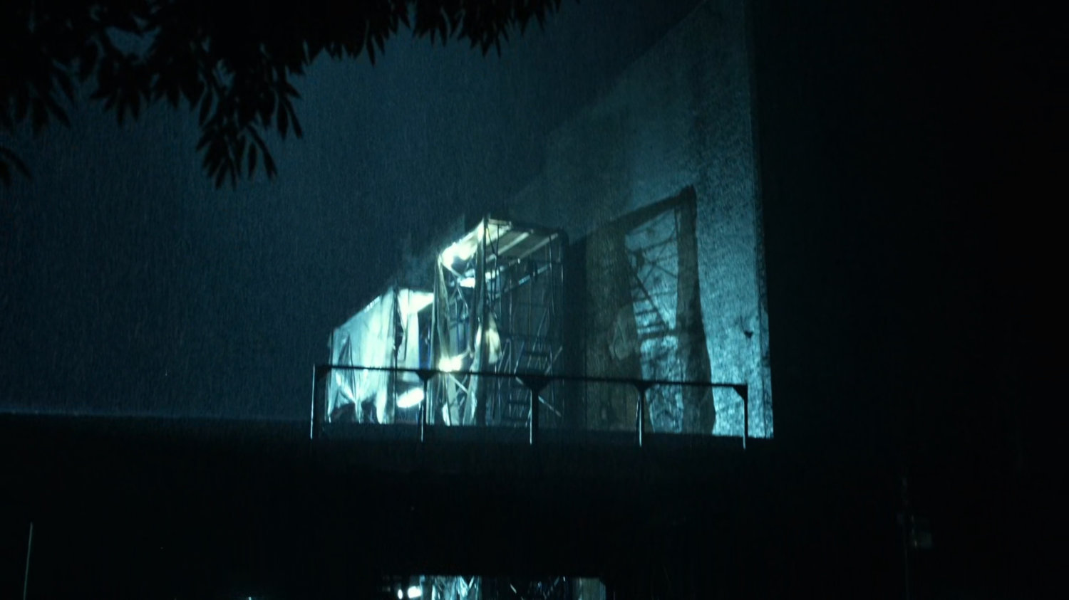 Rainy exterior of Karen's apartment.