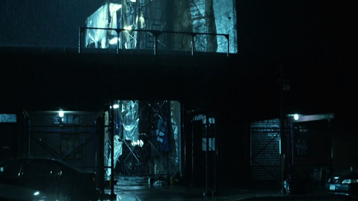 Rainy exterior of Karen's apartment.