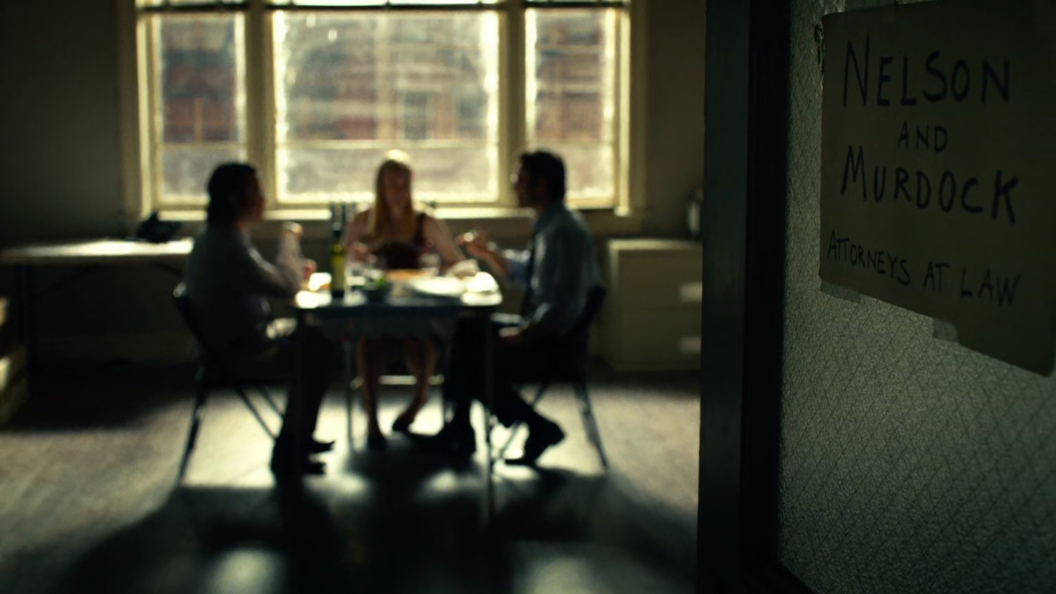 Foggy, Matt and Karen sharing a meal in their law offices.