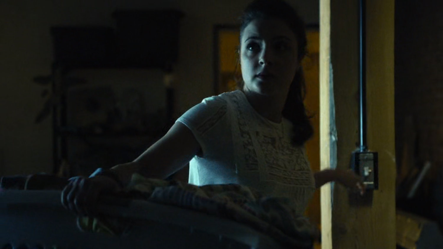 Tracey Farnum enters laundry room.