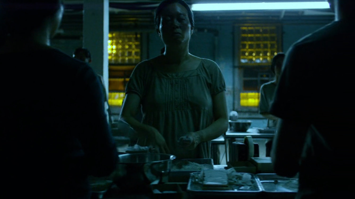 Blind workers in Madame Gao's drug warehouse.