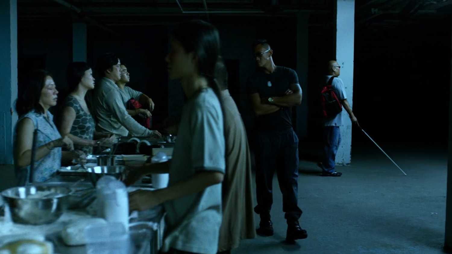Blind workers in Madame Gao's drug warehouse.