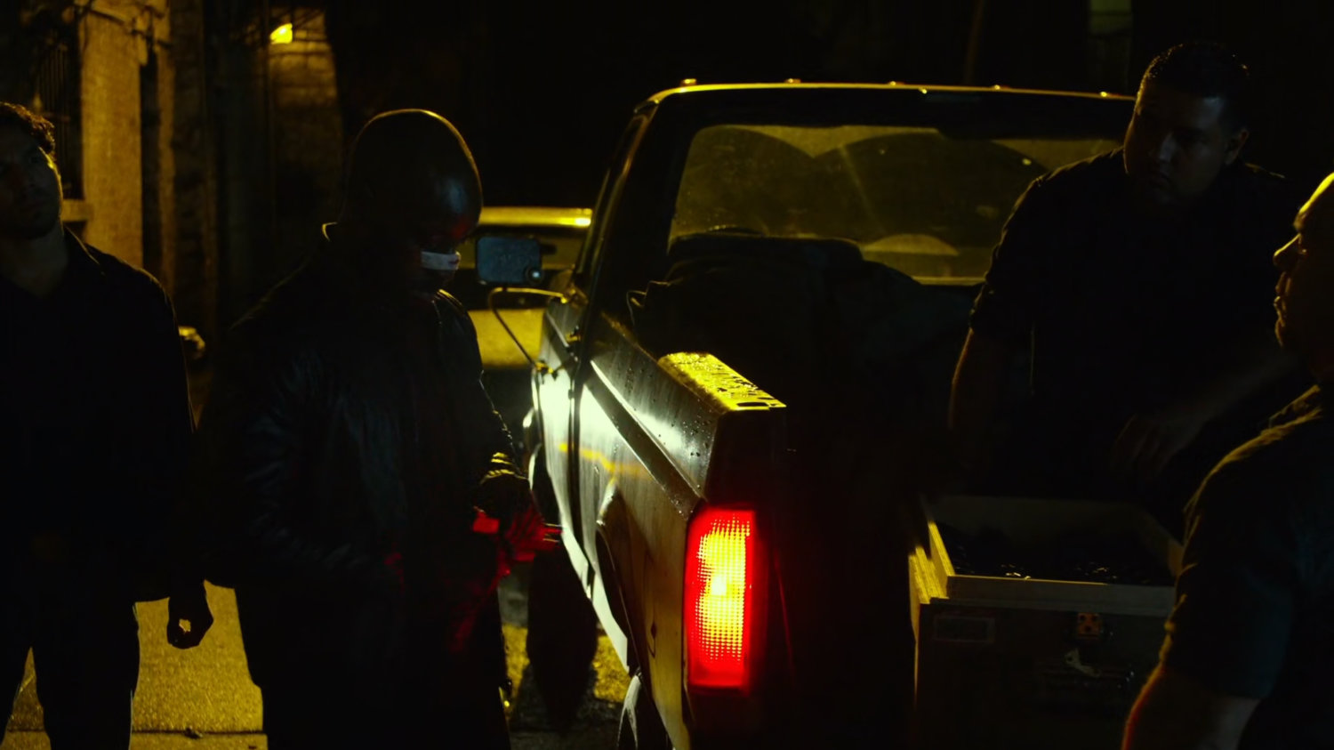 Turk buying a gun in a dark alley.