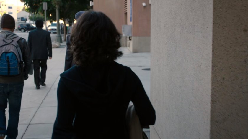 Raina walking on Vancouver sidewalk.