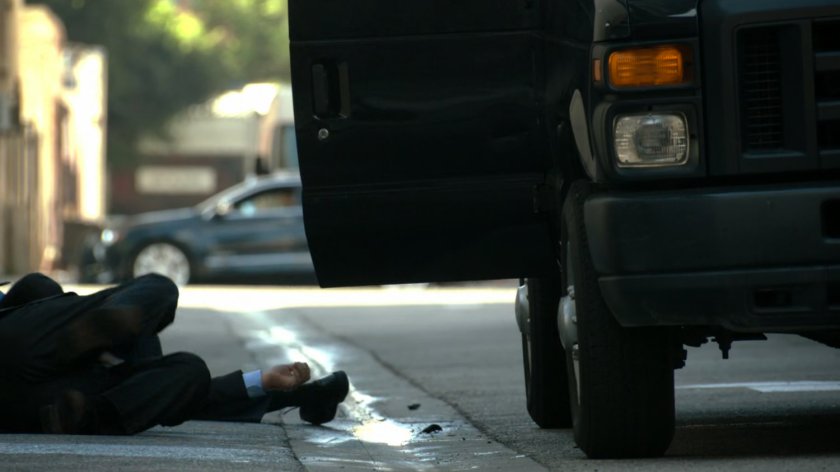 Body in alley by van.