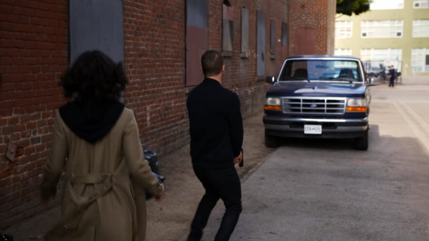 Hunter and Raina in a brick alley in Vancouver.