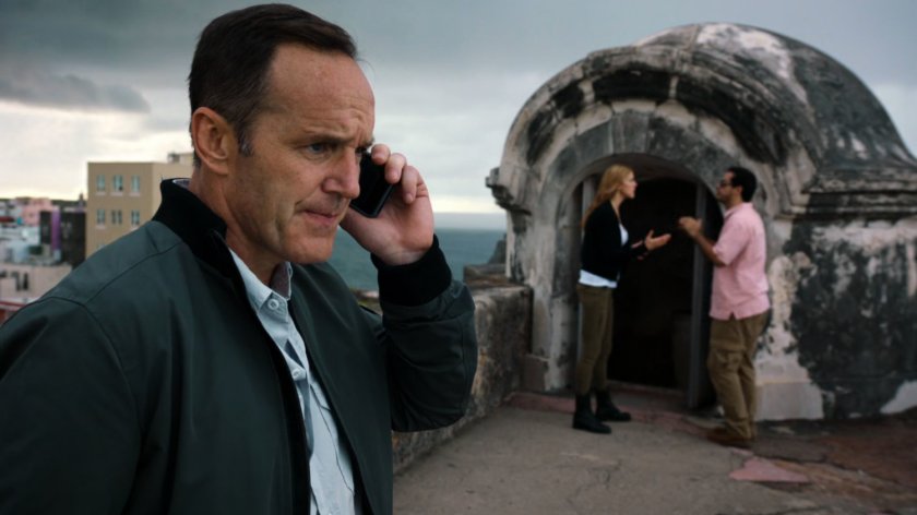 Coulson on phone in front of Bobbi and man near the southern tower at Fort San Cristobal.