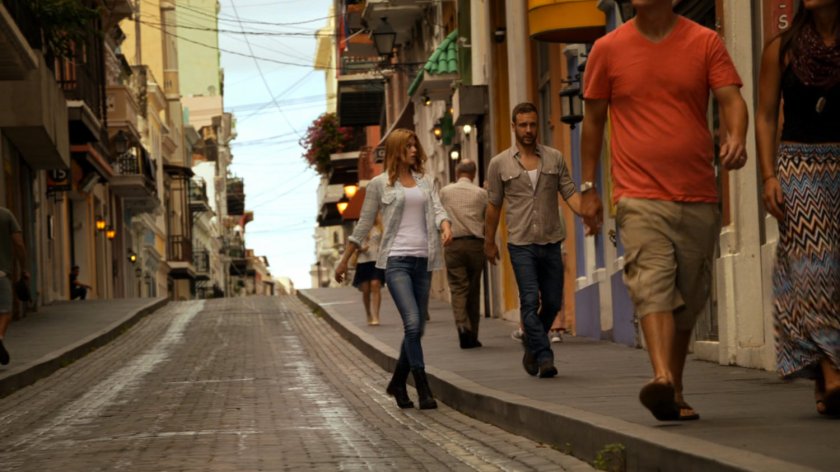 Bobbi and Hunter walk on a San Juan street.