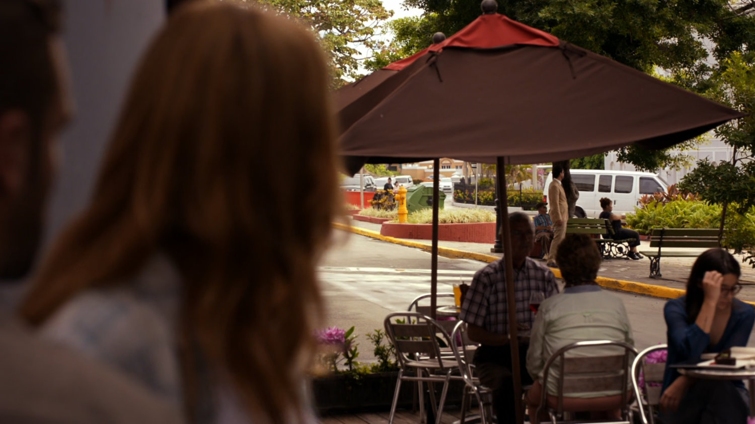 Bobbi observing people on a San Juan sidewalk.
