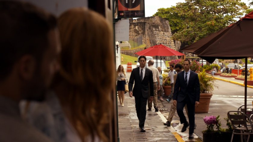 Men approaching Bobbi and Hunter on a San Juan sidewalk.