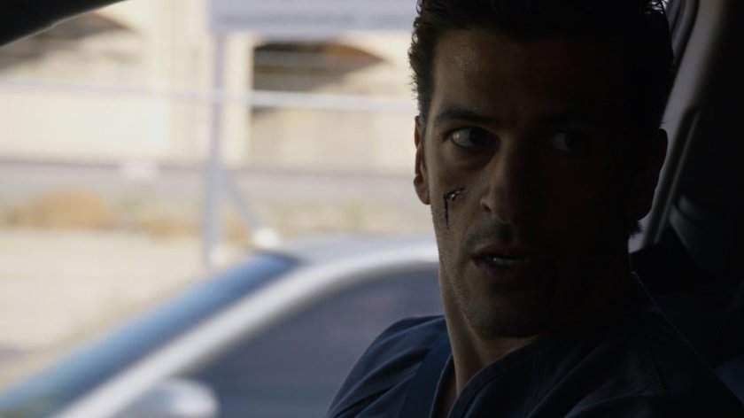 Bakshi in a vehicle on the street.